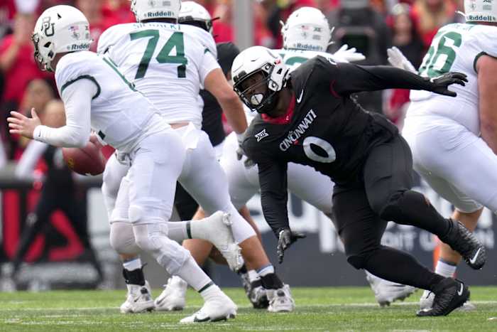 Cincinnati Bearcats defensive end Jowon Briggs (0) pressures Baylor Bears quarterback Blake Shapen (12) in the XX quarter during a college football game between the Baylor Bears and the Cincinnati Bearcats, Saturday, Oct. 21, 2023, at Nippert Stadium in Cincinnati.  